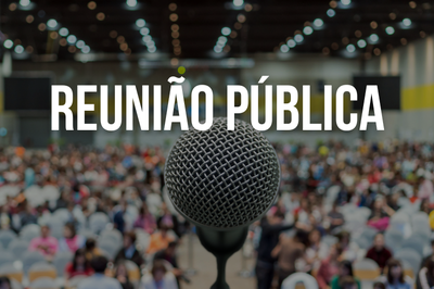 Reunião pública irá discutir projetos de lei relativos à segurança pública Imagem mostra um microfone diante uma multidão, representando uma reunião pública.