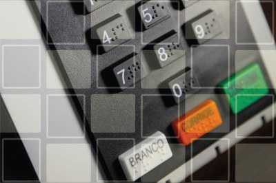Arte sobre foto da urna eletrônica. É possível ver os números e as teclas "branco", "corrige" e "confirma".