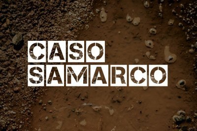Arte: Comunicação/MPF. Imagem de fundo marrom imitando lama e ao centro a expressão caso samarco escrita com letras brancas.